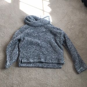 A fluffy turtle neck sweater
